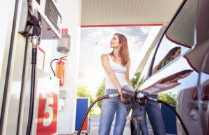 Woman filling gas tank