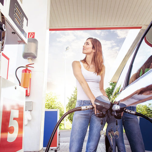 Woman filling gas tank